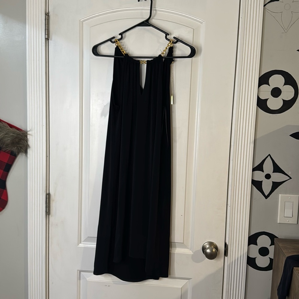 Black cocktail dress with gold accents